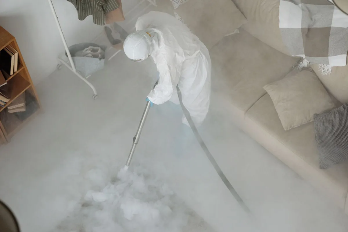 Biohazard cleanup technician in protective equipment, Alkali Flat, Sacramento, CA